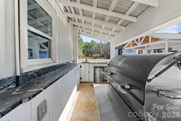 a brick house with tree in front of it