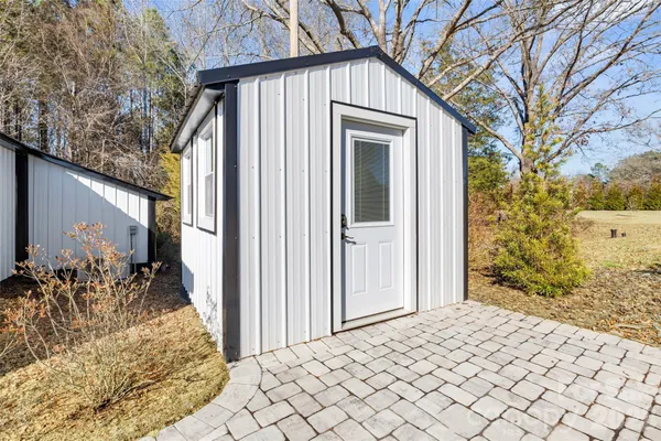 a view of a back yard of the house