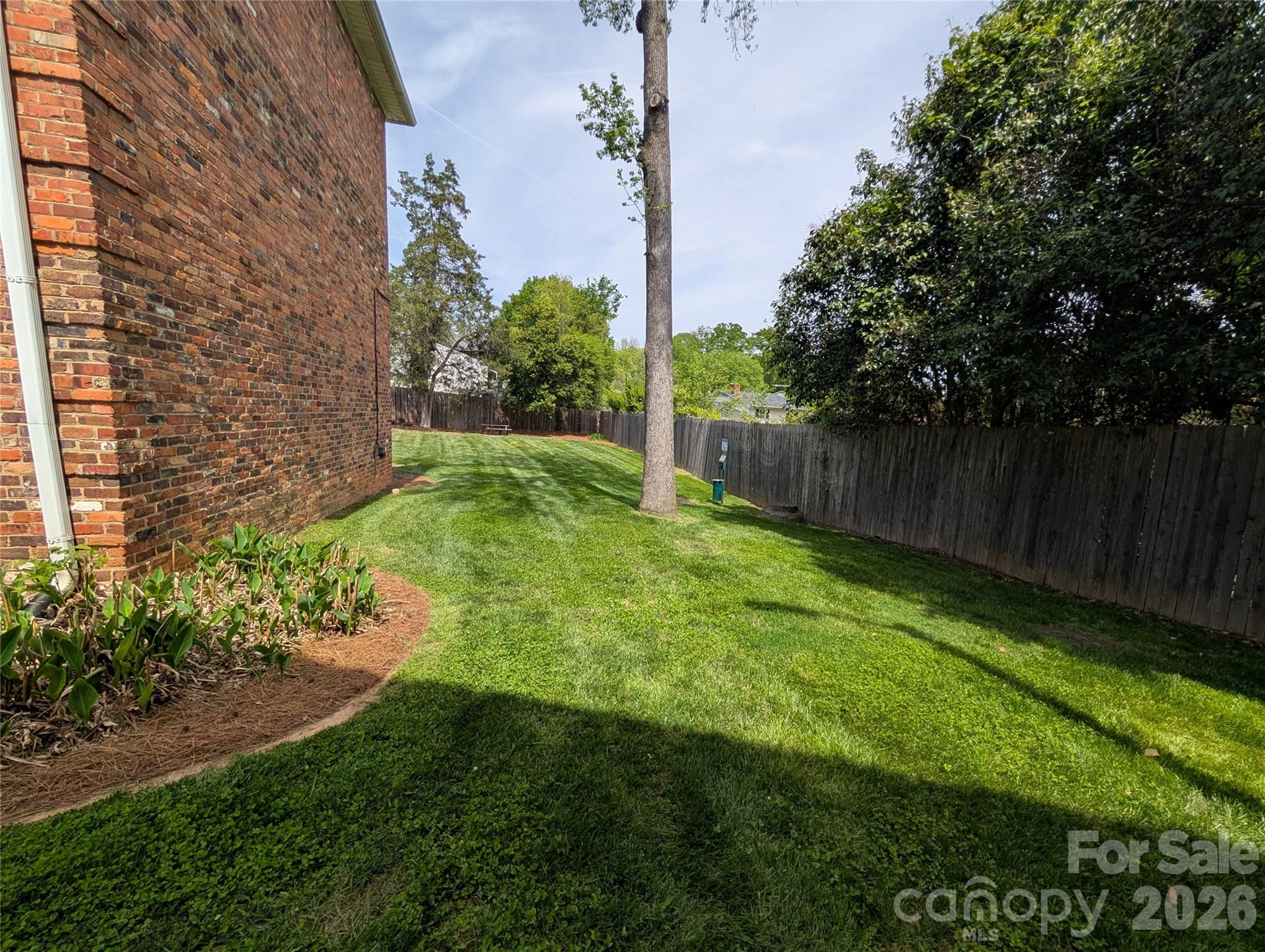 916 McAlway Road, Unit D Charlotte, NC 28211 - Photo 7 of 12 a view of a backyard with a garden