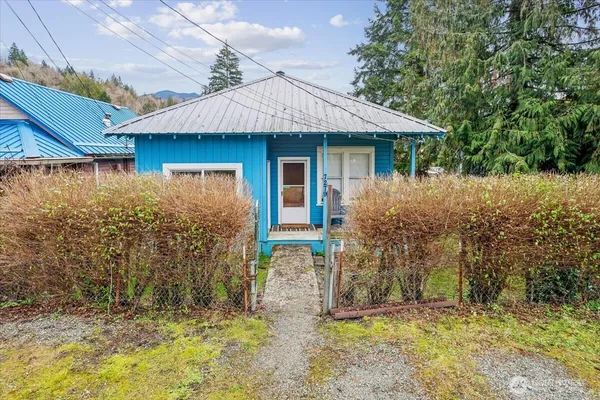 front view of a house with a yard