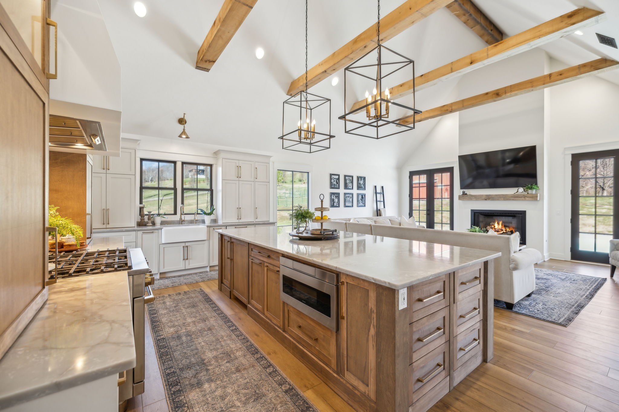 4676 Reed Road Thompson's Station, TN 37179 - Photo 14 of 67 a kitchen with stainless steel appliances granite countertop a sink and a stove