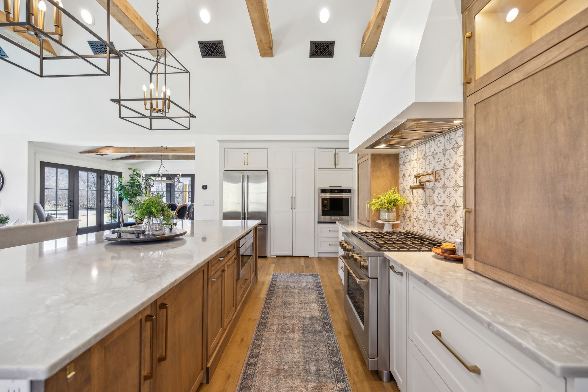 4676 Reed Road Thompson's Station, TN 37179 - Photo 16 of 67 a view of a kitchen with kitchen island granite countertop lots of counter top space and wooden floor