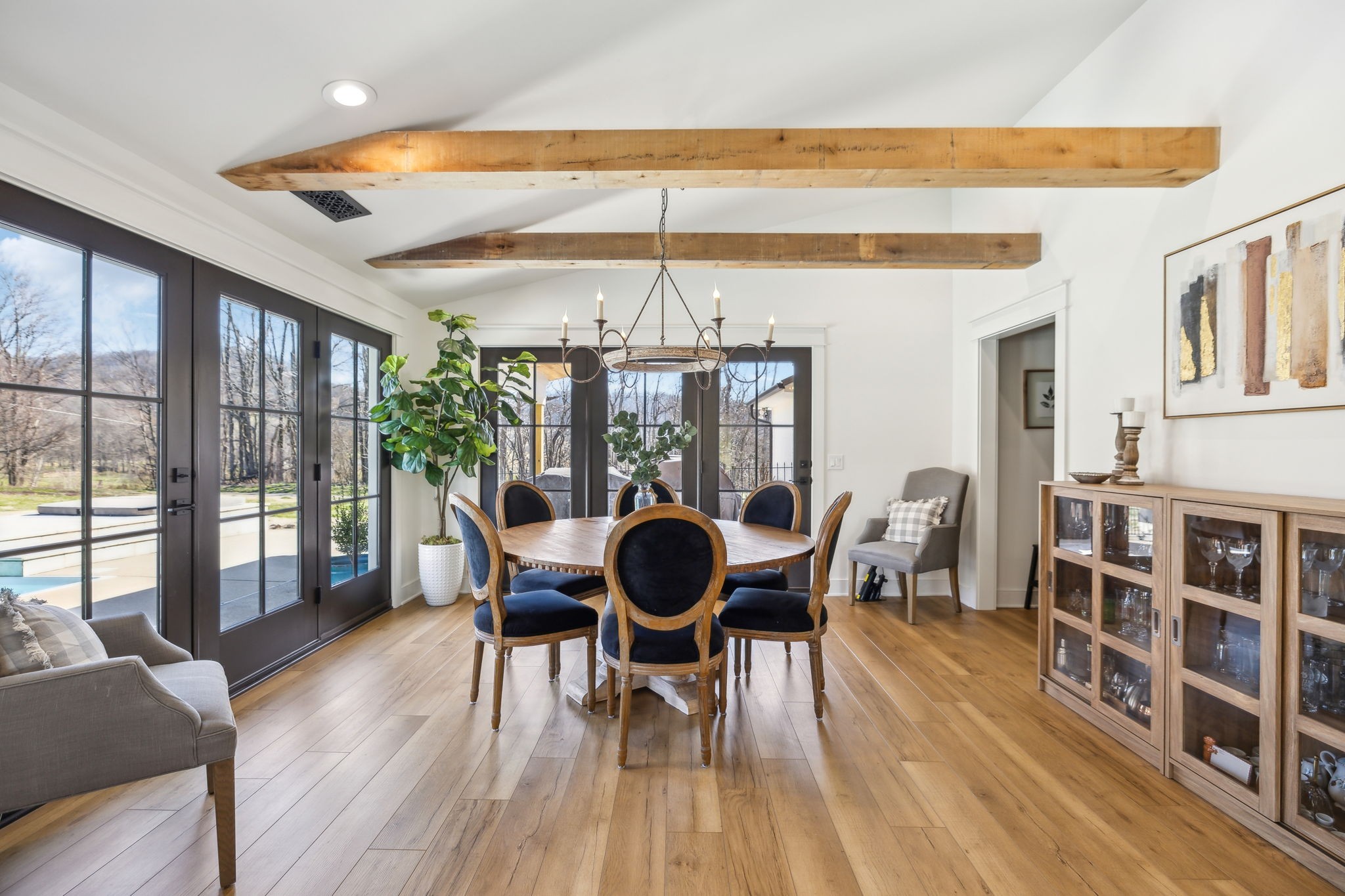 4676 Reed Road Thompson's Station, TN 37179 - Photo 30 of 67 a dining room with furniture wooden floor and a rug