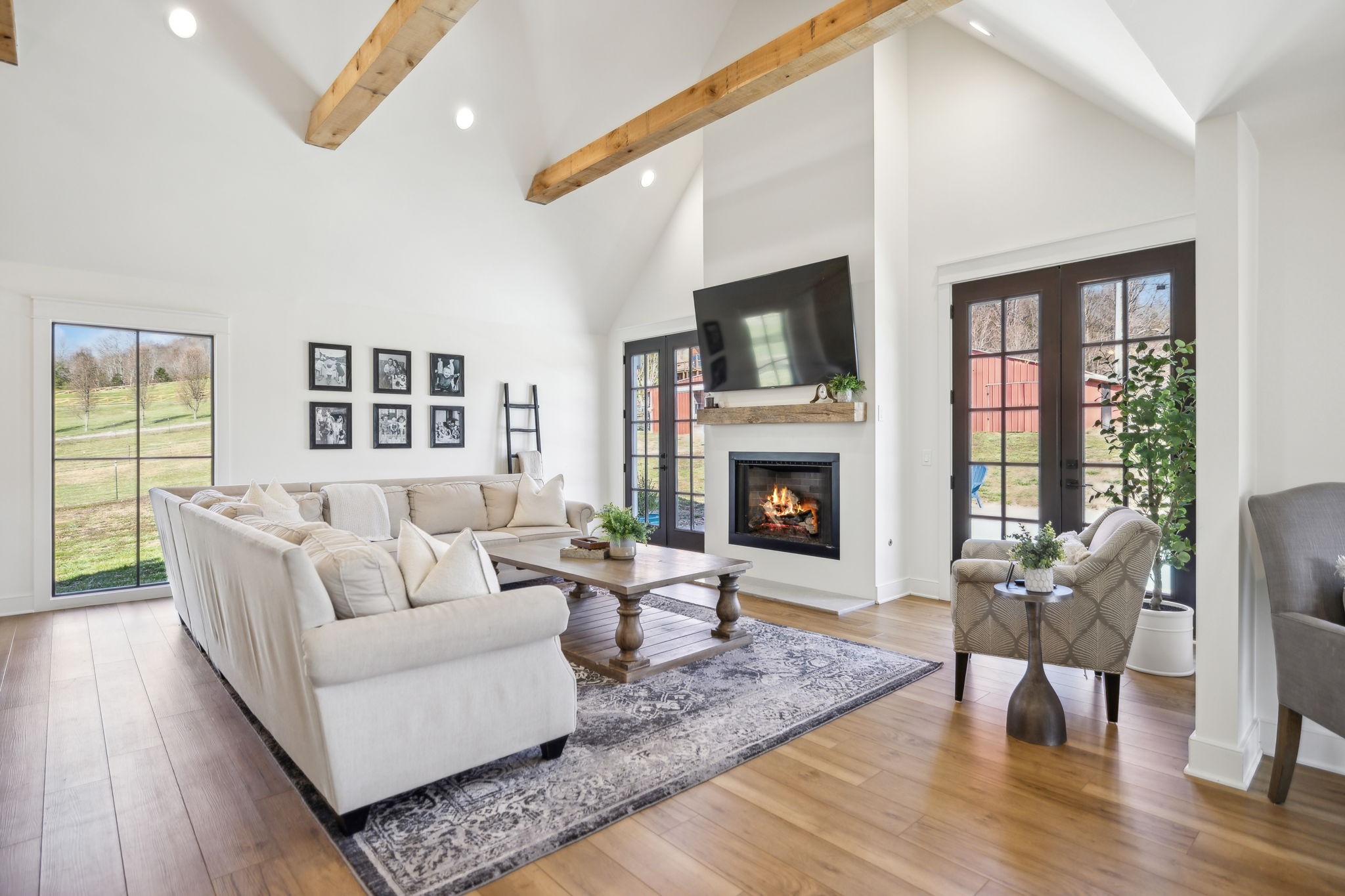 4676 Reed Road Thompson's Station, TN 37179 - Photo 31 of 67 a living room with furniture and a fireplace