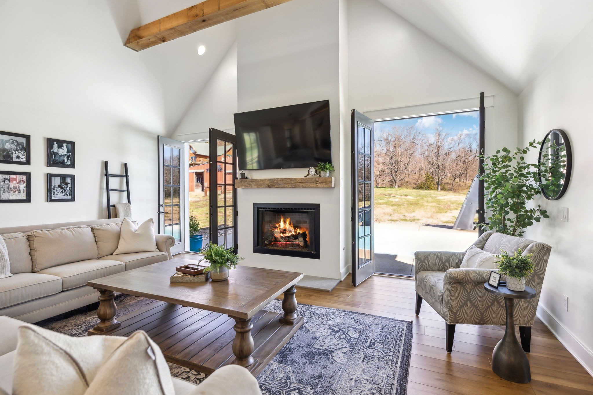 4676 Reed Road Thompson's Station, TN 37179 - Photo 35 of 67 a living room with furniture a flat screen tv and a fireplace