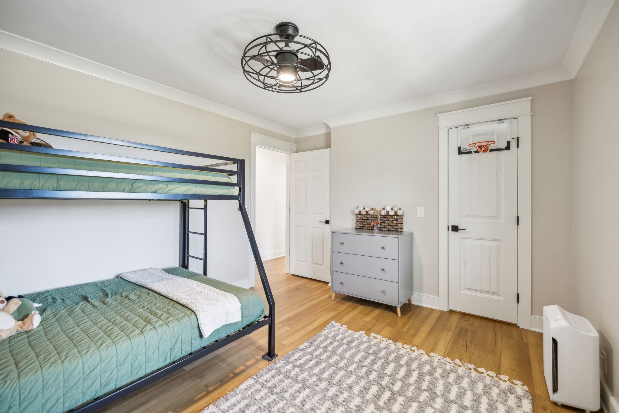 4676 Reed Road Thompson's Station, TN 37179 - Photo 39 of 67 a bedroom with a bed and a chandelier