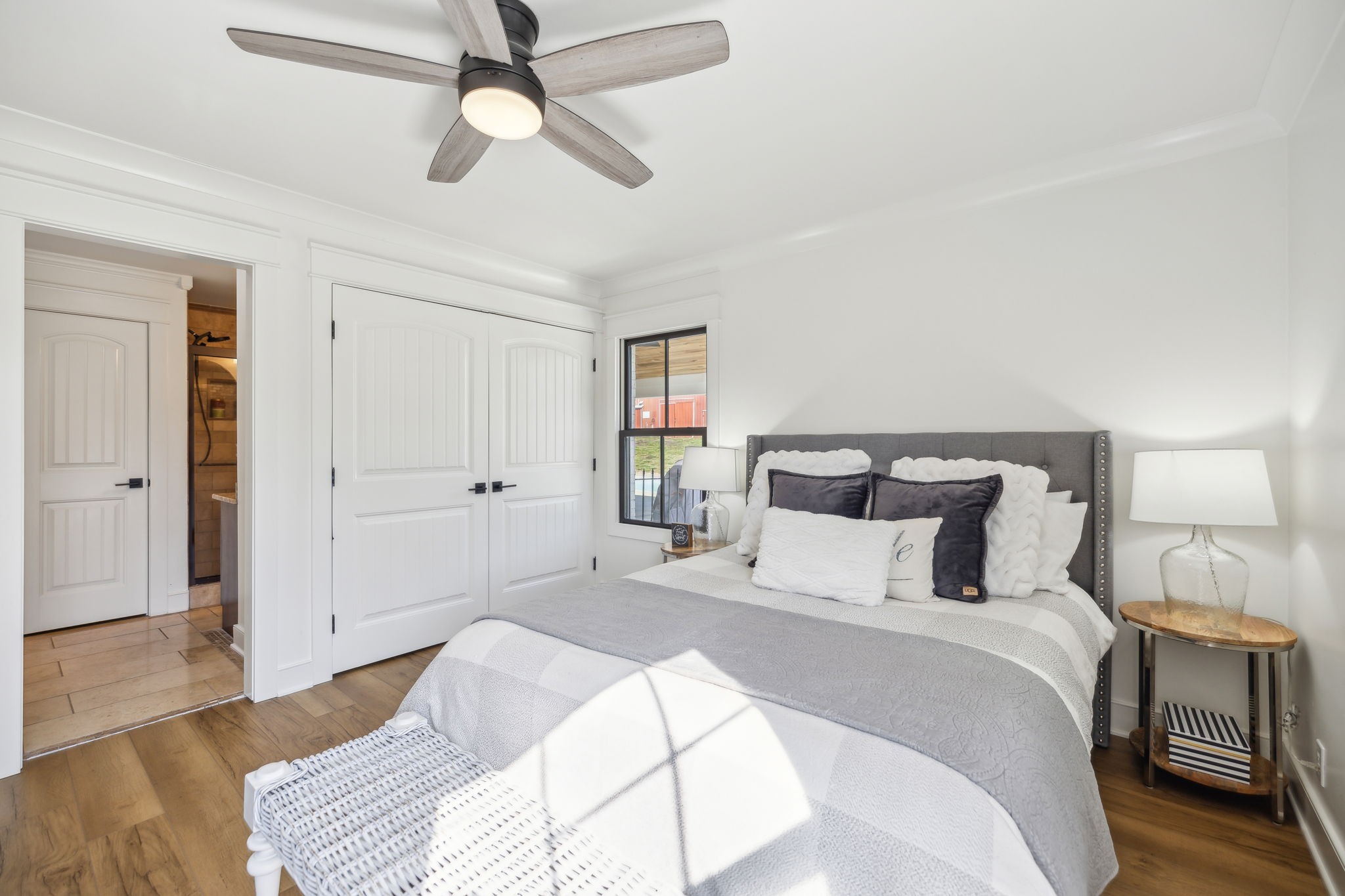 4676 Reed Road Thompson's Station, TN 37179 - Photo 43 of 67 a bedroom with a bed and a chandelier