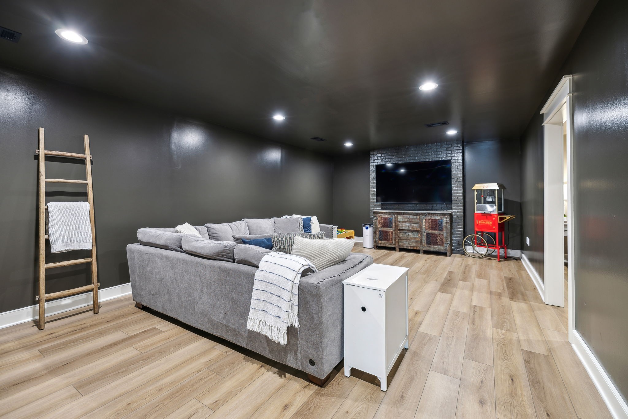 4676 Reed Road Thompson's Station, TN 37179 - Photo 47 of 67 a living room with furniture and a flat screen tv