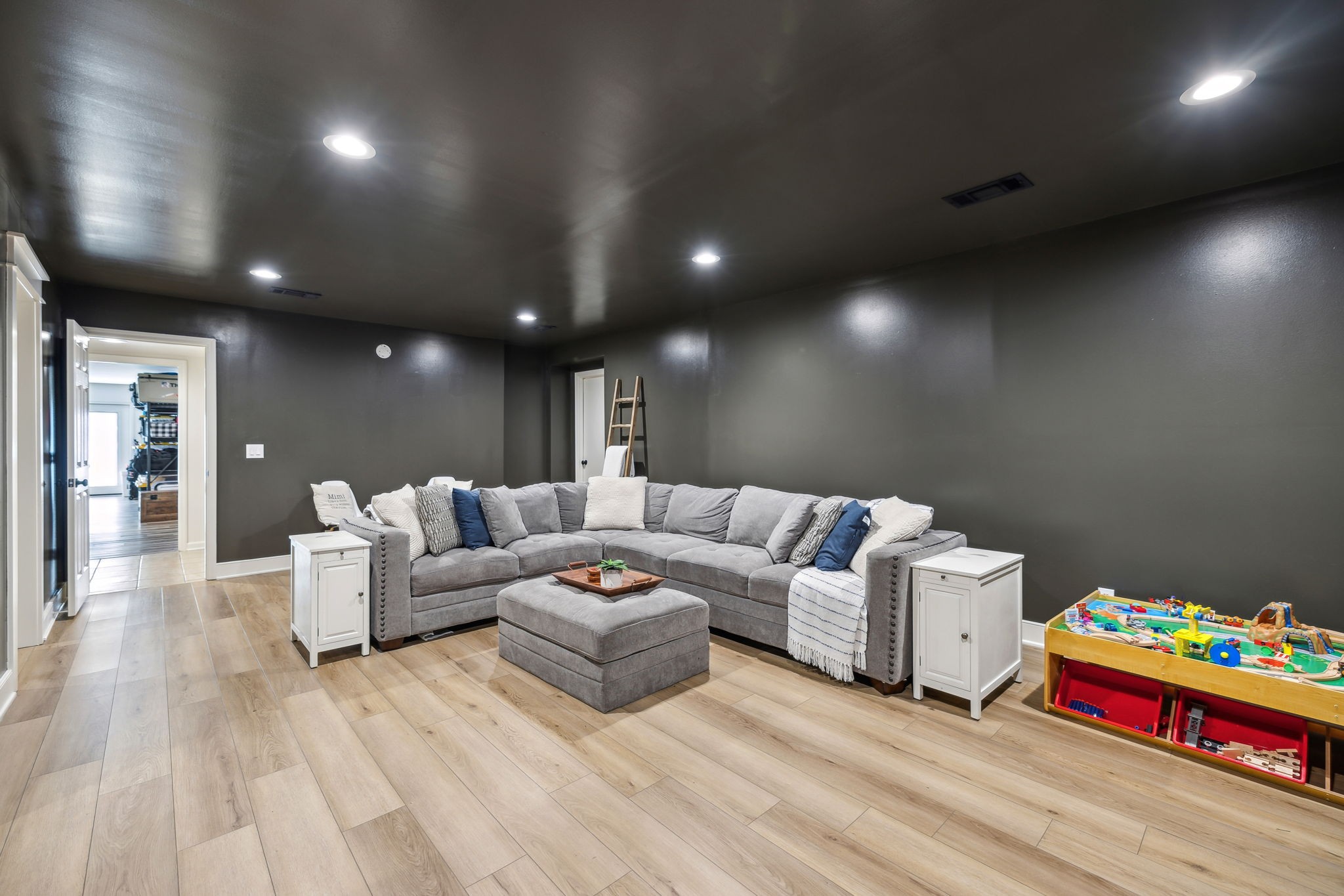 4676 Reed Road Thompson's Station, TN 37179 - Photo 48 of 67 a living room with furniture and a wooden floor