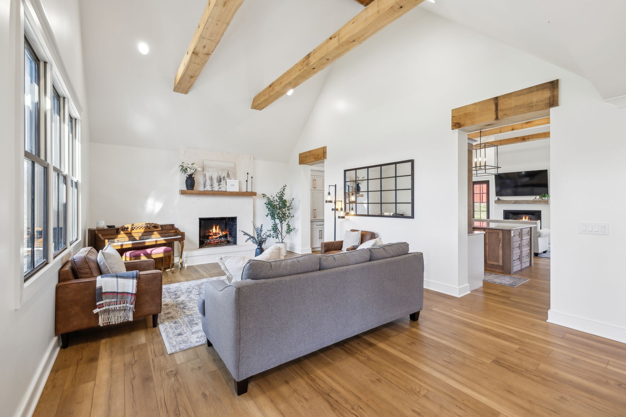 4676 Reed Road Thompson's Station, TN 37179 - Photo 6 of 67 a living room with furniture and a fireplace