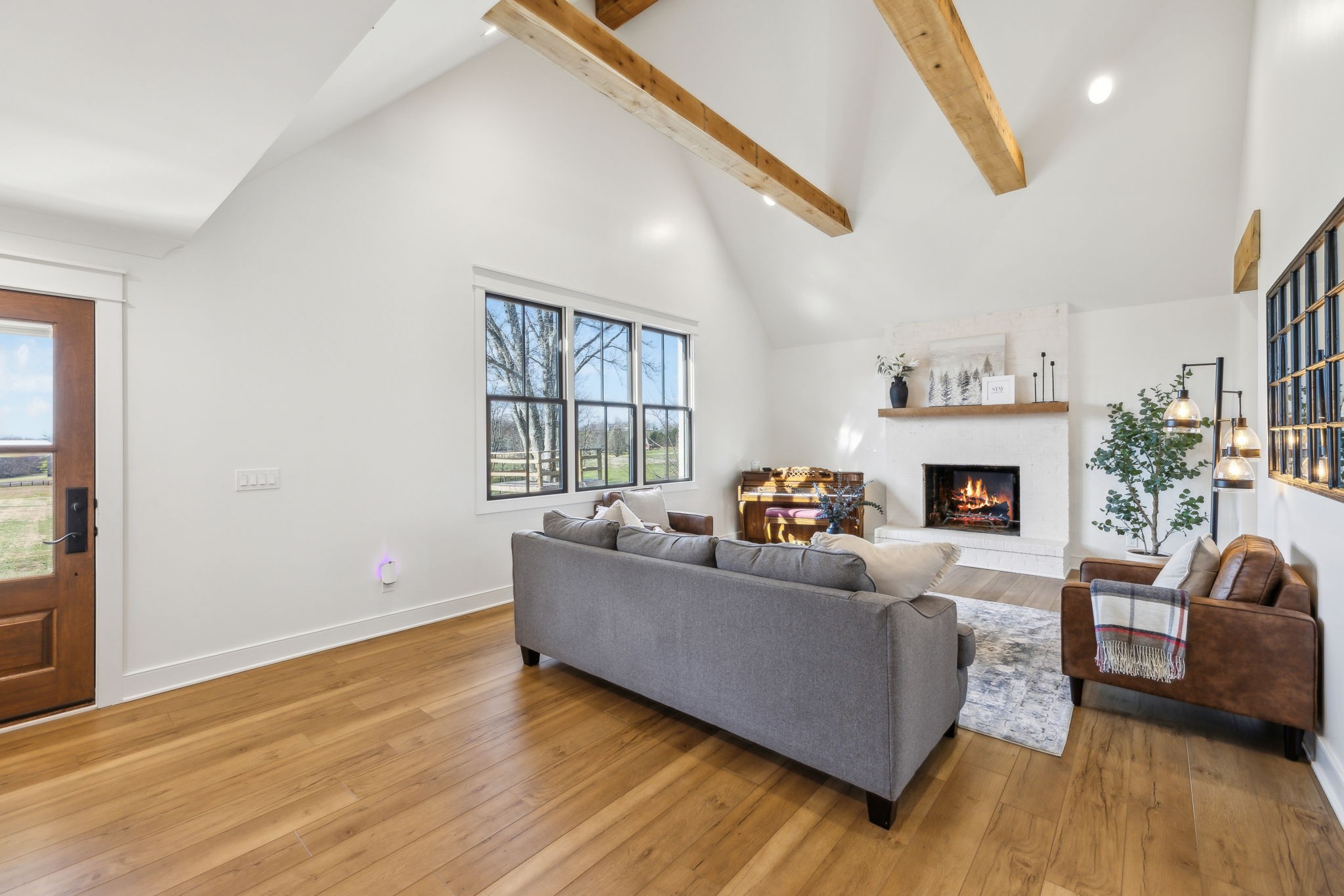 4676 Reed Road Thompson's Station, TN 37179 - Photo 7 of 67 a living room with furniture and a fireplace