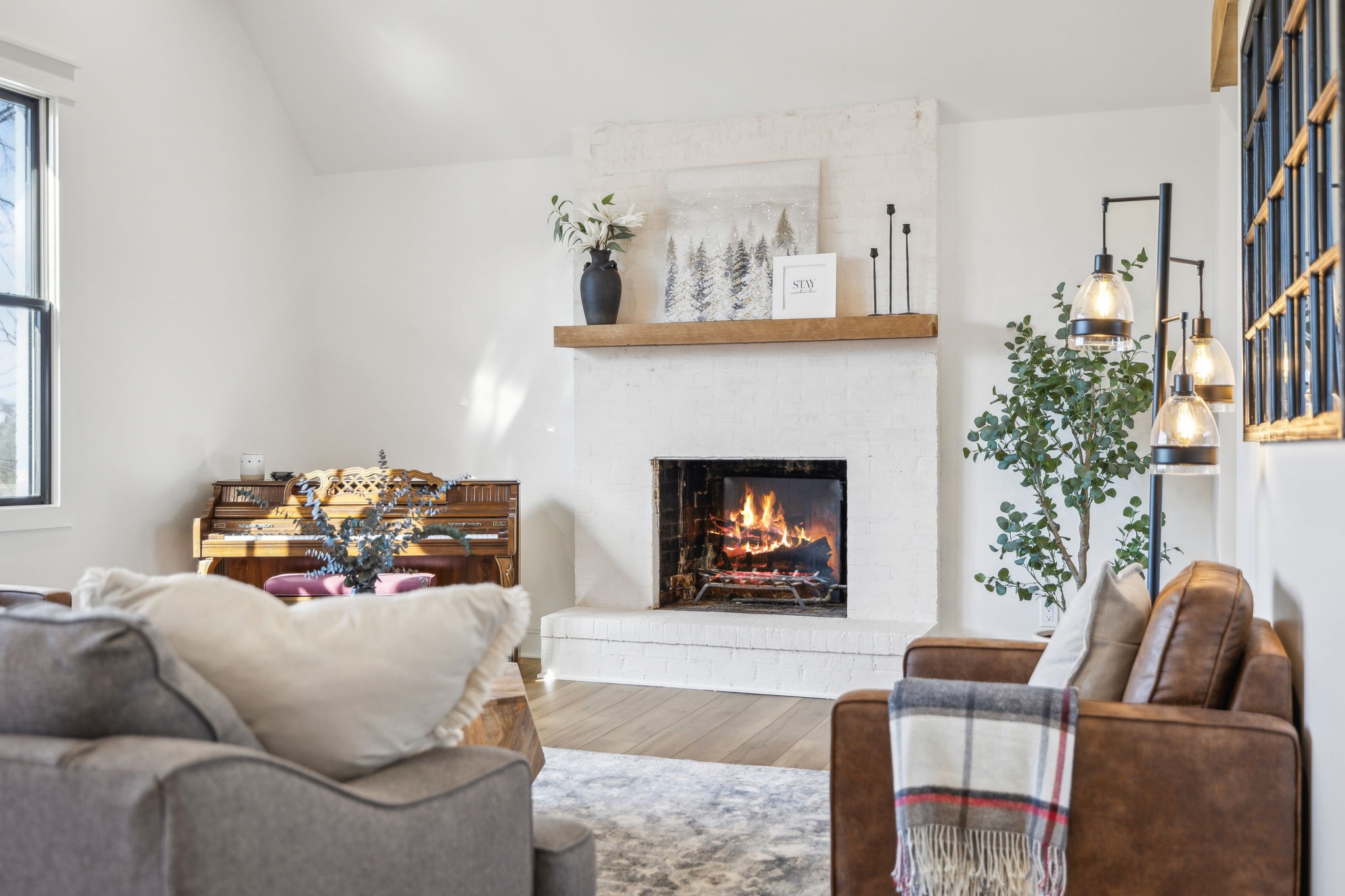 4676 Reed Road Thompson's Station, TN 37179 - Photo 8 of 67 a living room with furniture and a fireplace
