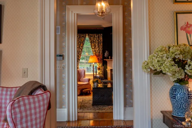 a living room with lots of furniture and a book shelf