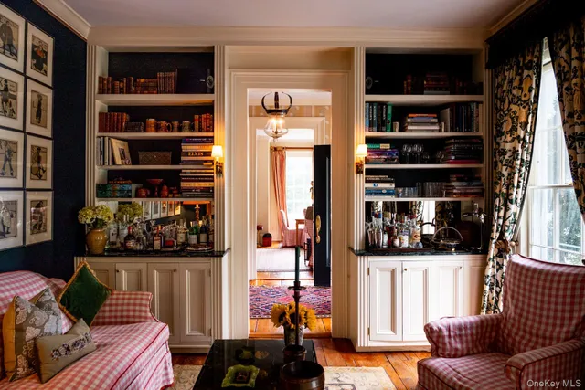 a living room with furniture a window and a fireplace
