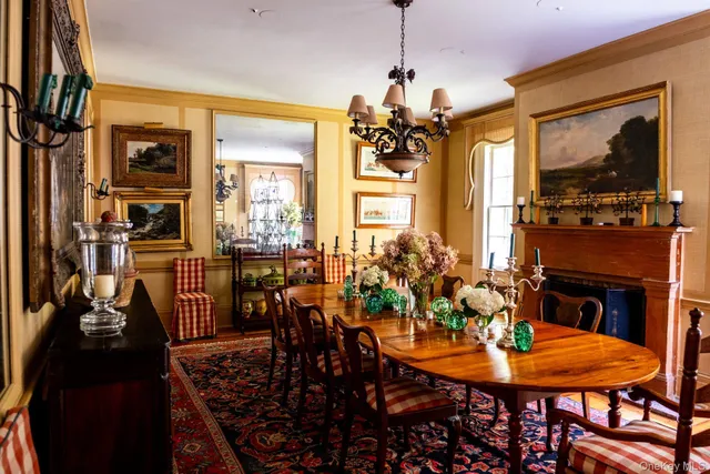 a view of a dining room with furniture and chandelier