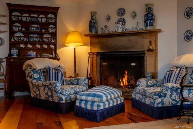 a view of a hallway with wooden floor and windows