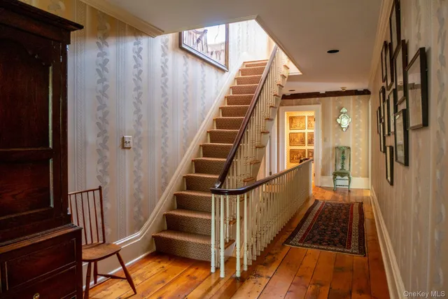 a view of entryway with a door and wooden floor