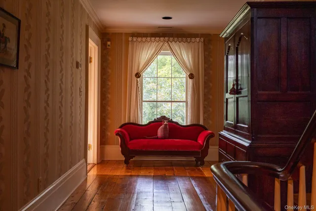a view of a patio with furniture and a garden
