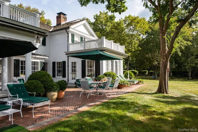 a view of swimming pool with sitting area and garden