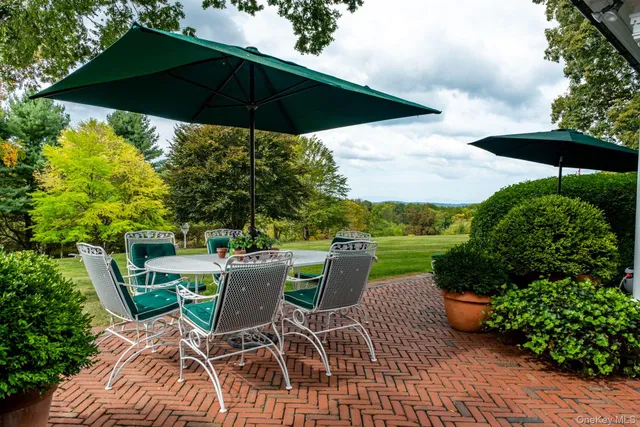 a view of a wooden house with a yard