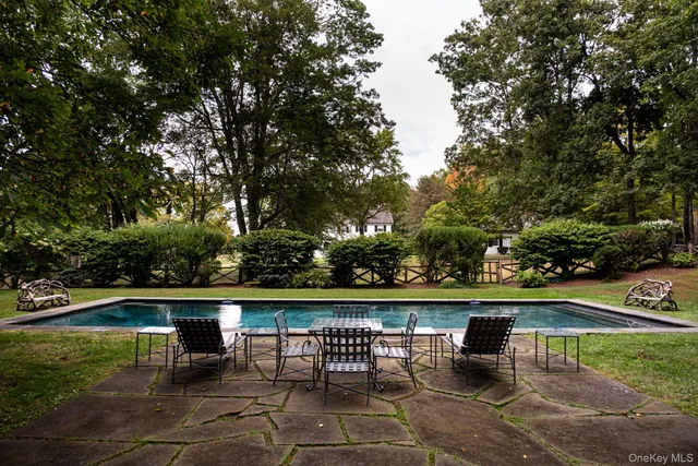 a view of a table and chairs in the garden