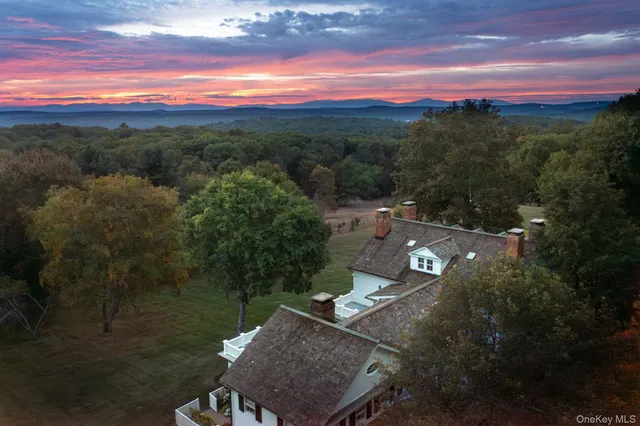 a view of a street with a yard