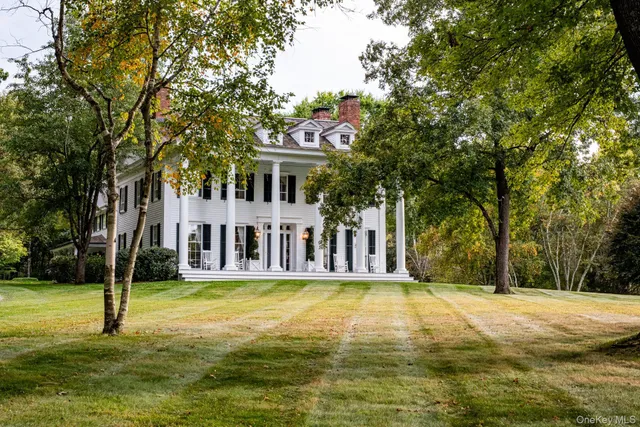 front view of building with a garden