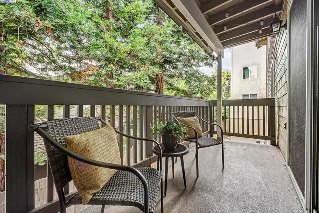 a view of balcony with furniture and wooden deck