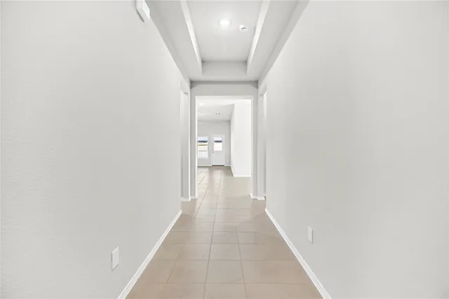 a view of a hallway with a white walls
