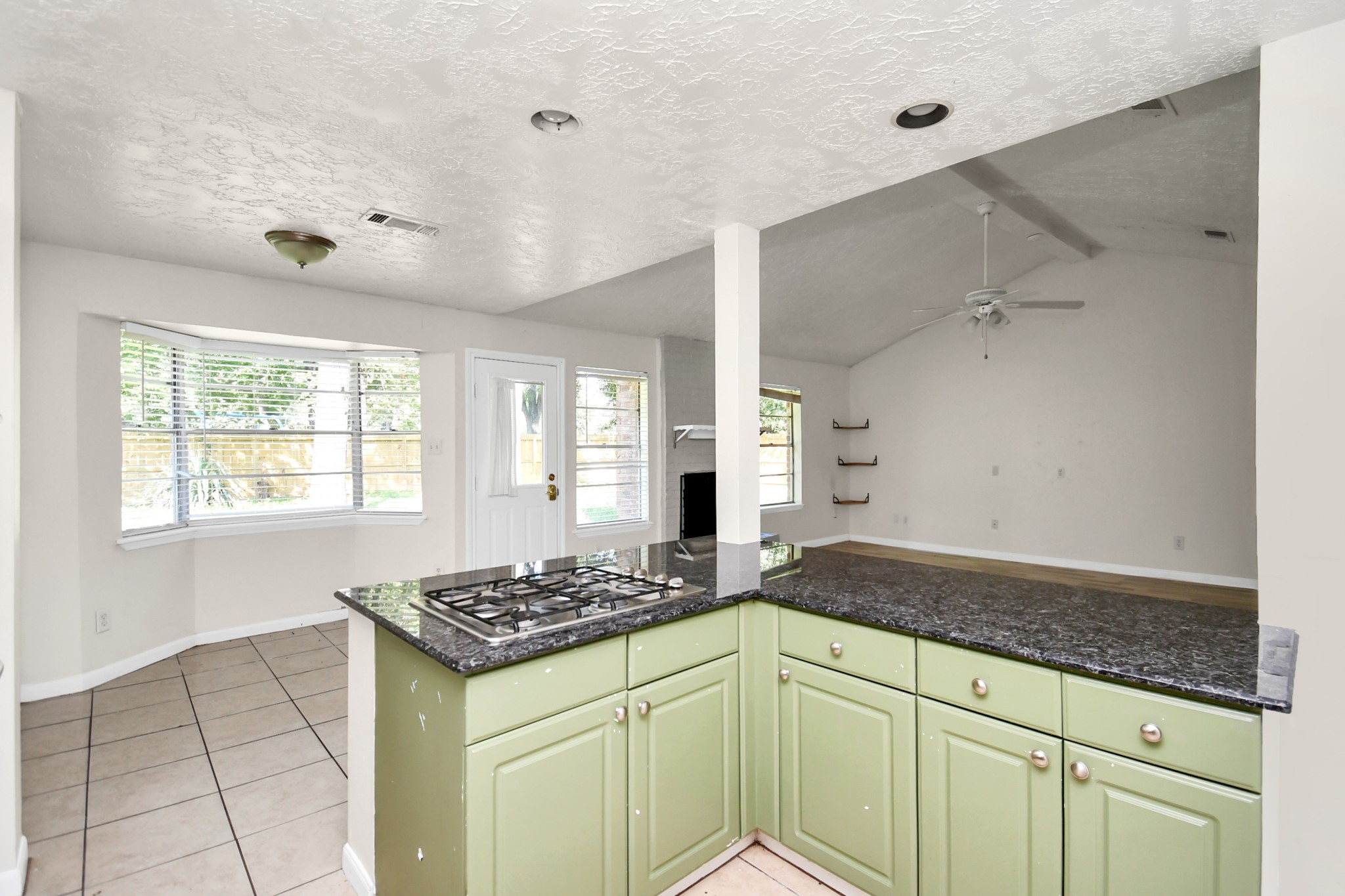 18023 Woodgum Drive Spring, TX 77388 - Photo 20 of 38 a kitchen with a sink a stove cabinets and a window