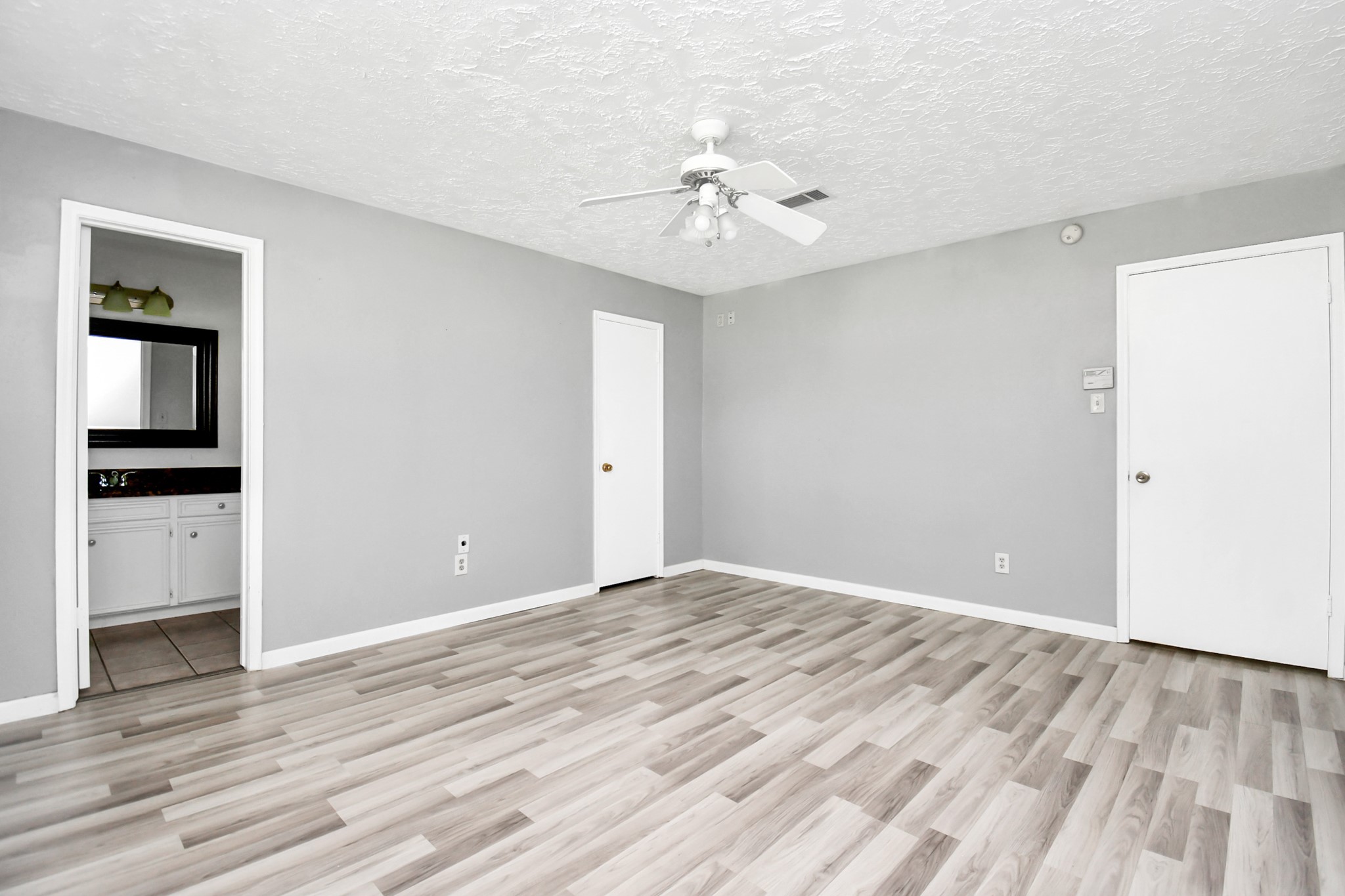 18023 Woodgum Drive Spring, TX 77388 - Photo 24 of 38 wooden floor in an empty room with a window