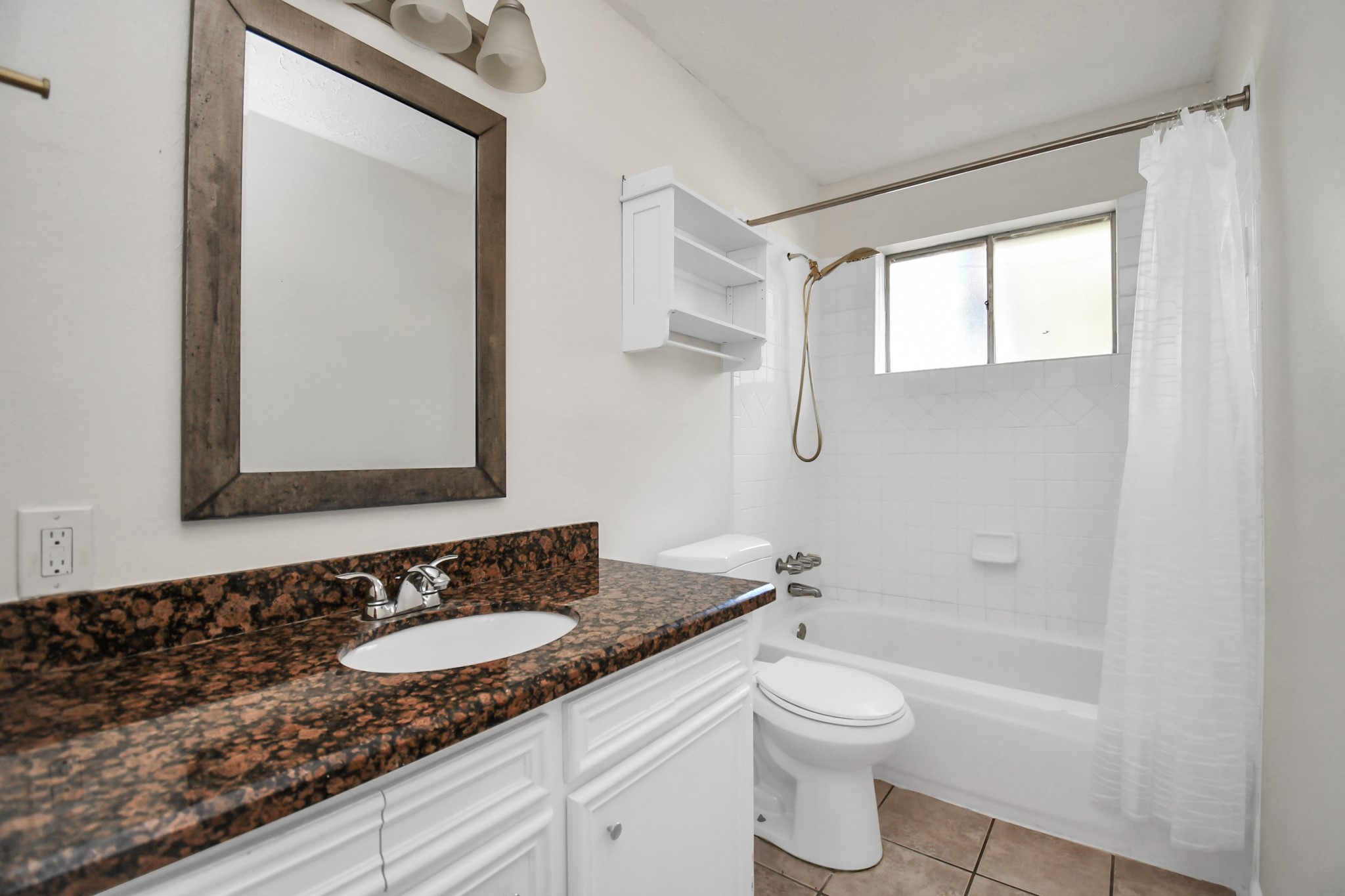 18023 Woodgum Drive Spring, TX 77388 - Photo 26 of 38 a bathroom with a granite countertop sink toilet a large mirror and shower