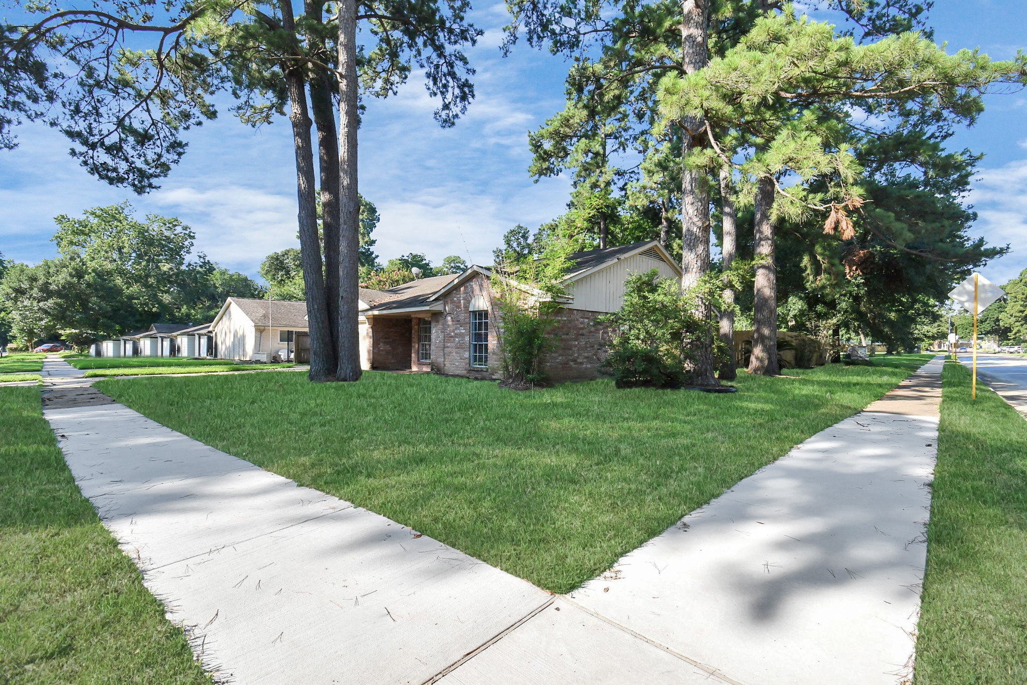 18023 Woodgum Drive Spring, TX 77388 - Photo 5 of 38 a view of a house with a tree in a park