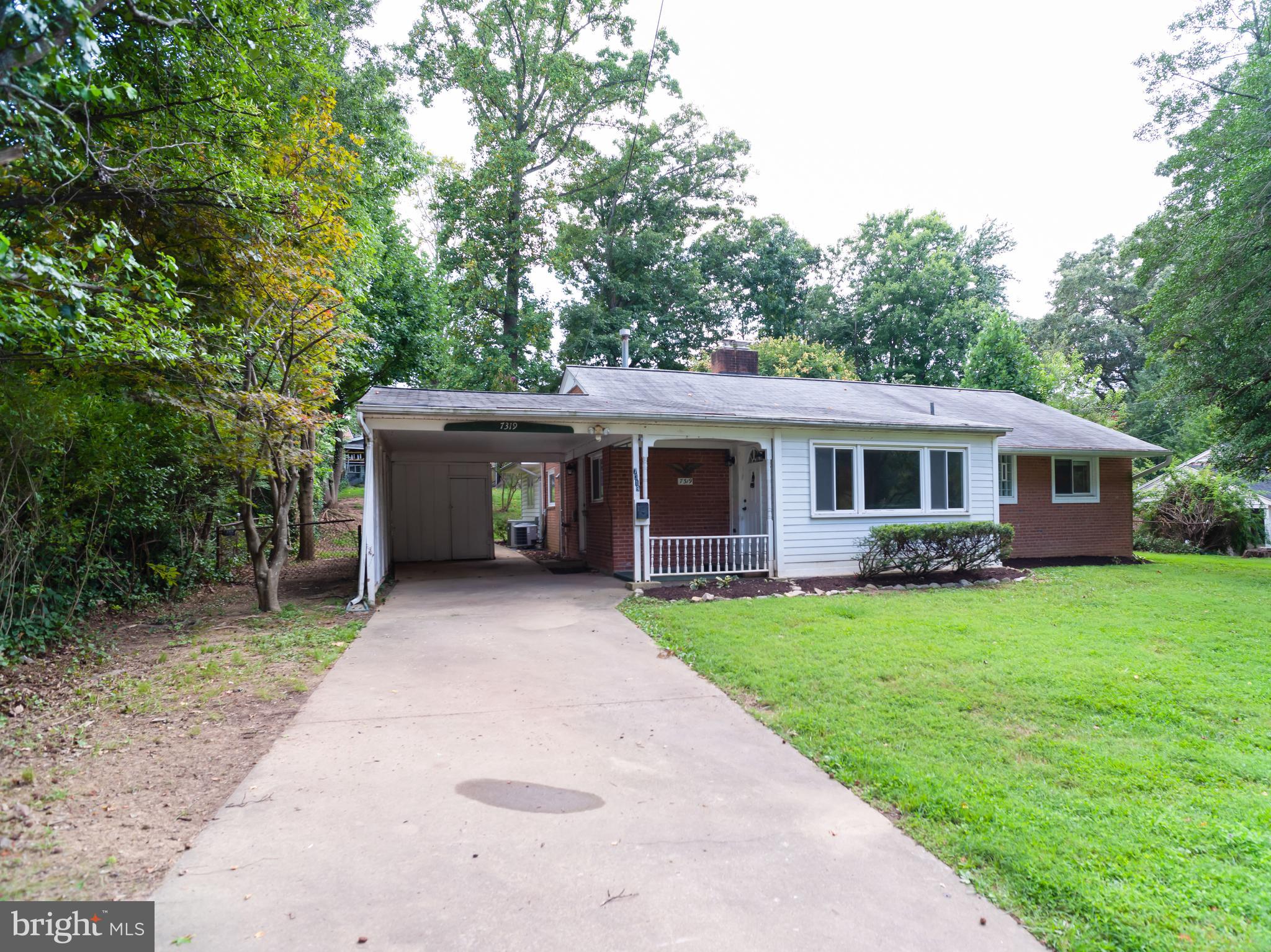 7319 Monticello Boulevard Springfield, VA 22150 - Photo 12 of 27 a front view of a house with a garden