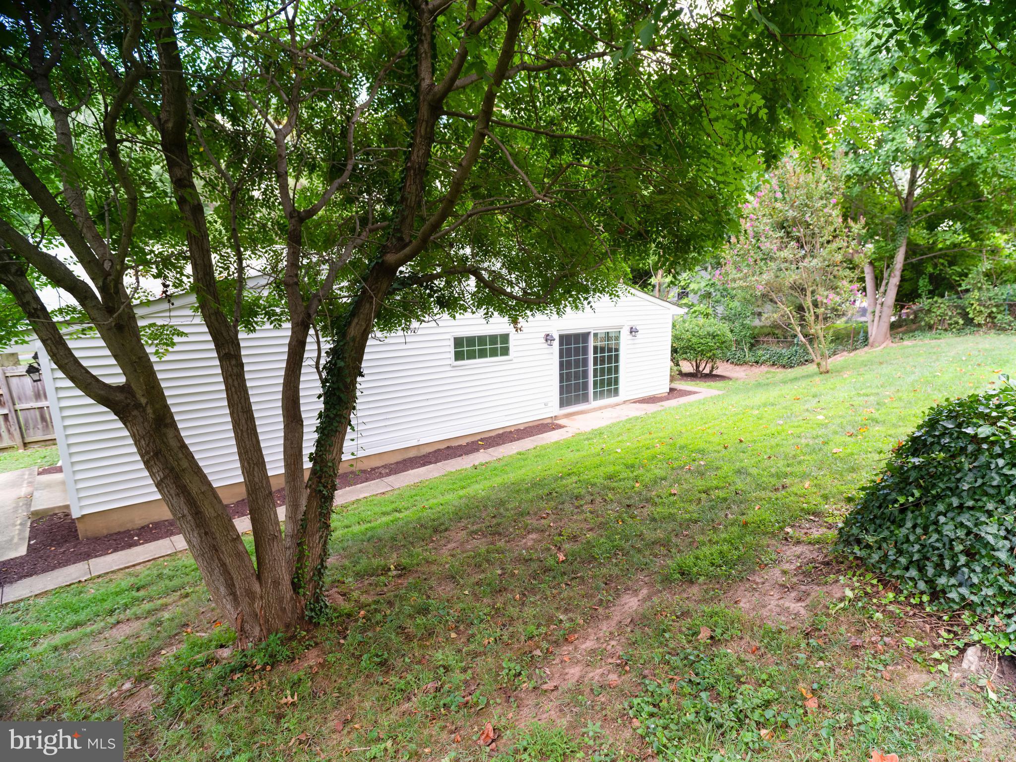 7319 Monticello Boulevard Springfield, VA 22150 - Photo 16 of 27 a view of a backyard with large trees