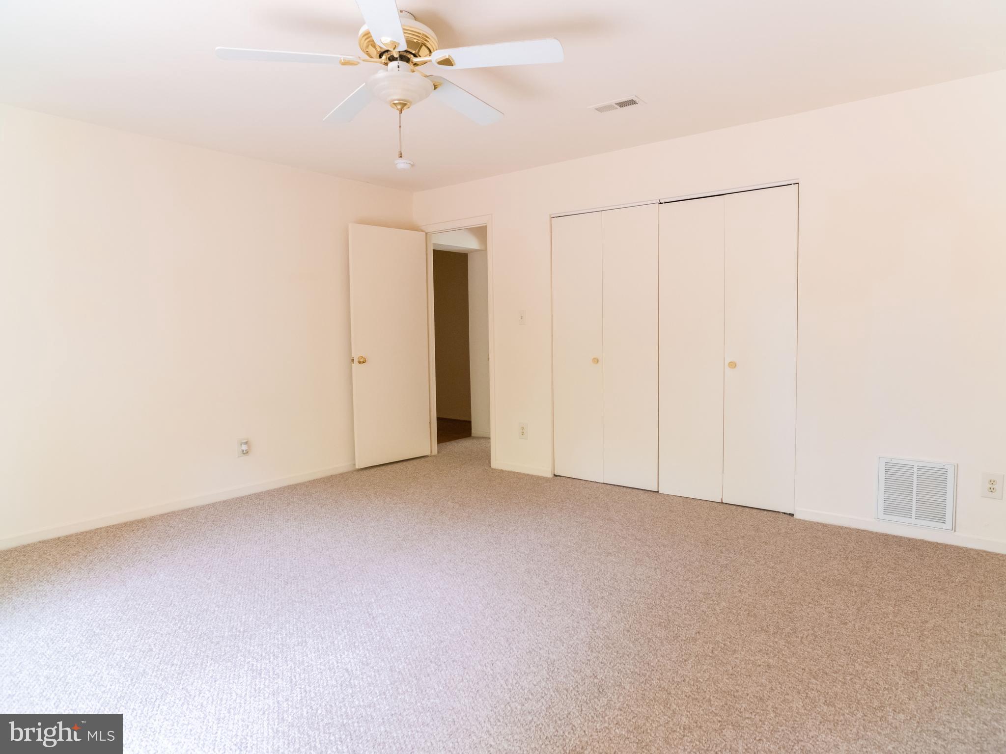 7319 Monticello Boulevard Springfield, VA 22150 - Photo 21 of 27 a view of a room with a ceiling fan and a window
