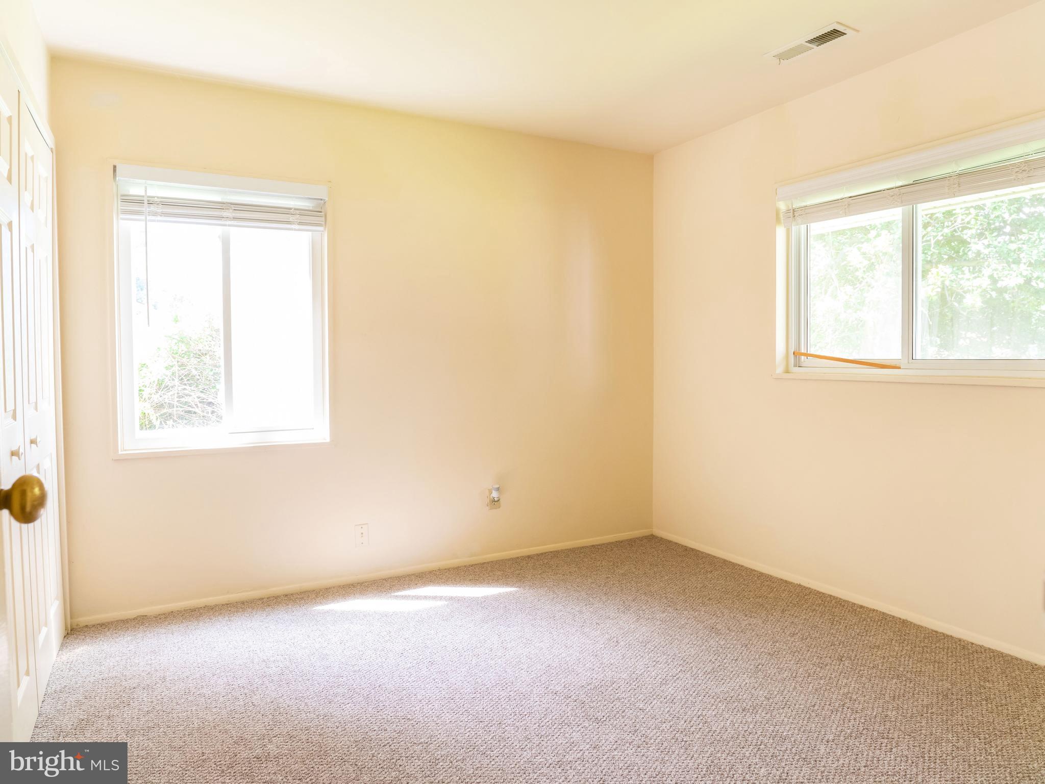 7319 Monticello Boulevard Springfield, VA 22150 - Photo 7 of 27 an empty room with windows