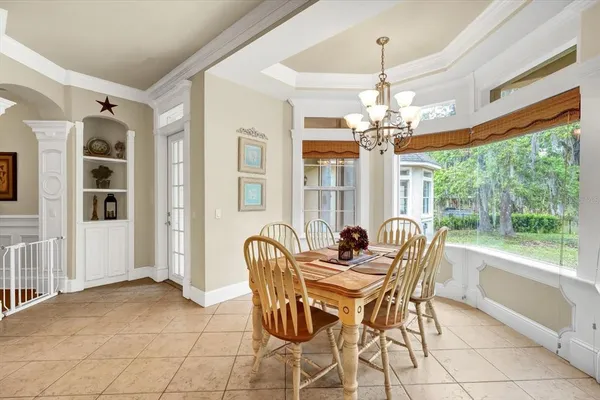 a spacious bathroom with a double vanity sink a large mirror and a bathtub