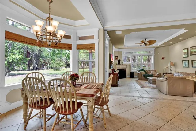 a bathroom with a tub a sink and a window