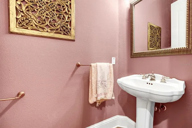 a living room with furniture and a book shelf