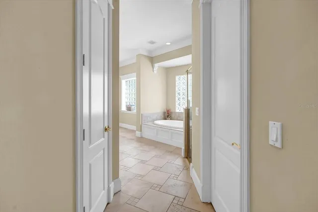 a living room with furniture and a book shelf