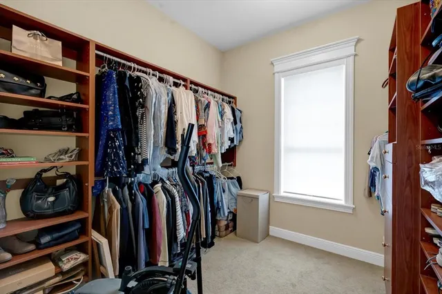 a bedroom with furniture and a window