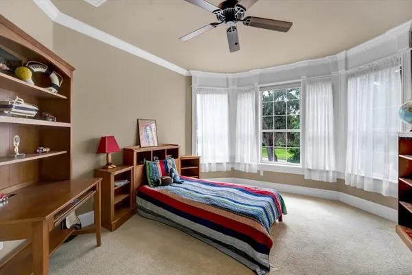 a view of staircase with white walls and a window
