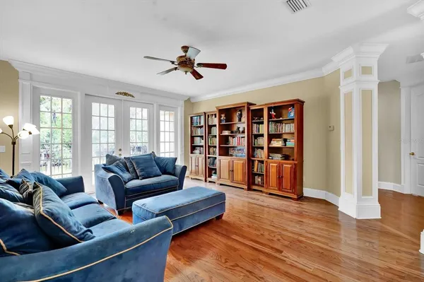 an aerial view of residential house with outdoor space and trees all around