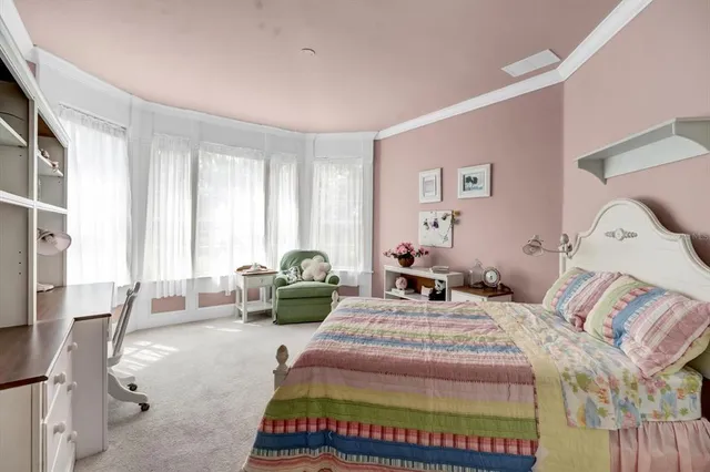 a picture of a room with a white wall and a painting