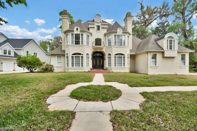 a view of a dining room with furniture window and chandelier
