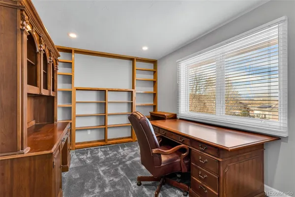 a room with table chair and window
