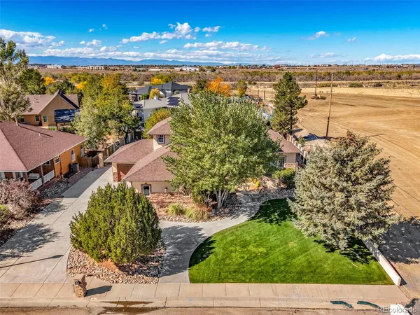 an aerial view of a house with yard swimming pool and outdoor seating