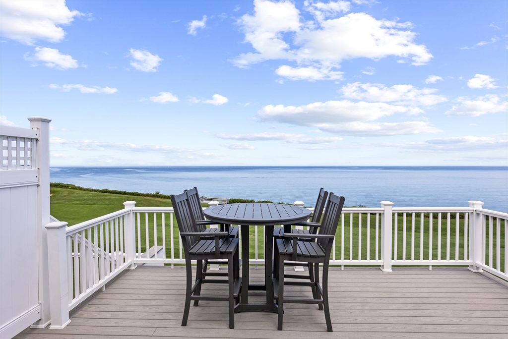 64 Cliffside Drive, Unit 64 Plymouth, MA 02360 - Photo 1 of 42 a view of a chairs and table on the wooden floor