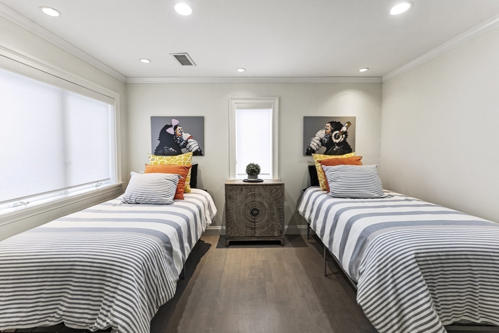 64 Cliffside Drive, Unit 64 Plymouth, MA 02360 - Photo 17 of 42 a bedroom with two beds and a window